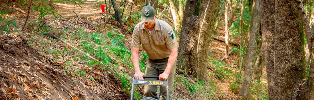 Open space ranger working on a trail